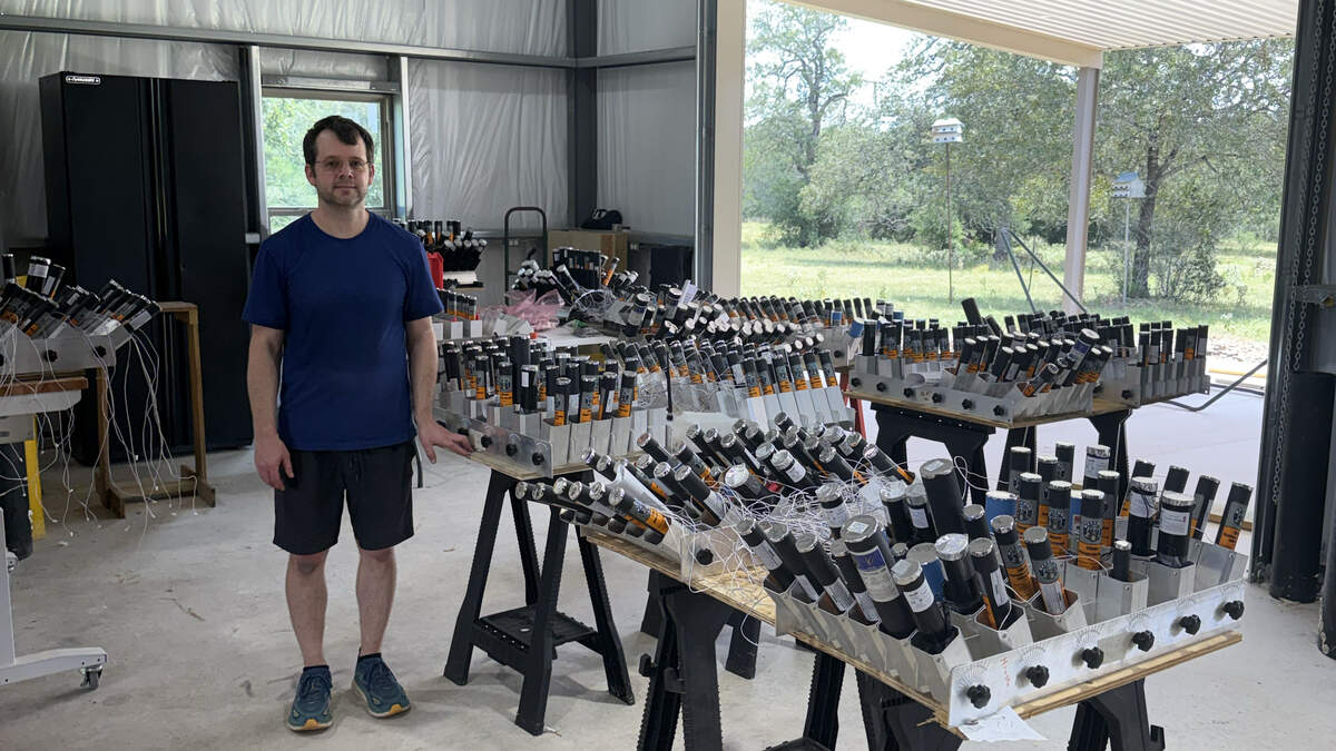 Dr. Rob Hruska, a neurosurgeon with Texas Health and a certified pyrotechnician, stands with his firework inventory for the show he’s planning for July 4, 2026.